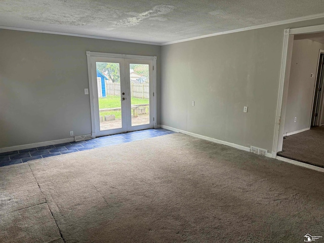 empty room featuring crown molding, french doors, carpet, and a textured ceiling