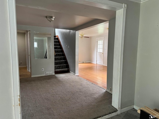 interior space featuring ceiling fan and wood-type flooring