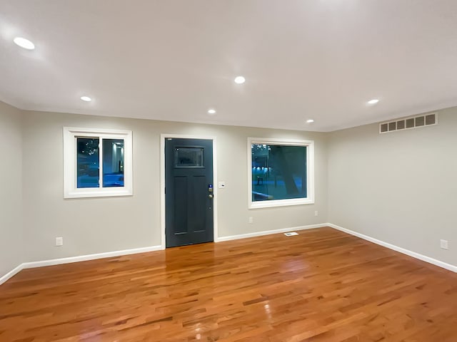 spare room with hardwood / wood-style flooring