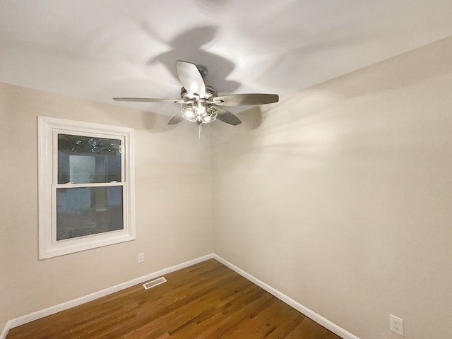 unfurnished room with ceiling fan and hardwood / wood-style flooring