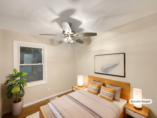 bedroom featuring ceiling fan and wood-type flooring