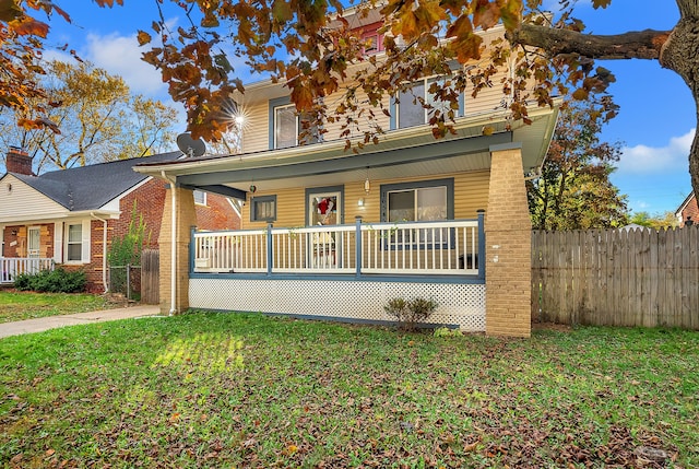 view of front facade with a porch and a front lawn