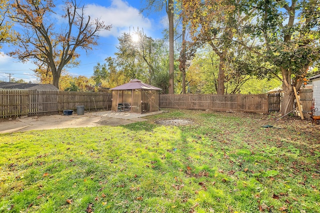 view of yard featuring a gazebo and a patio area