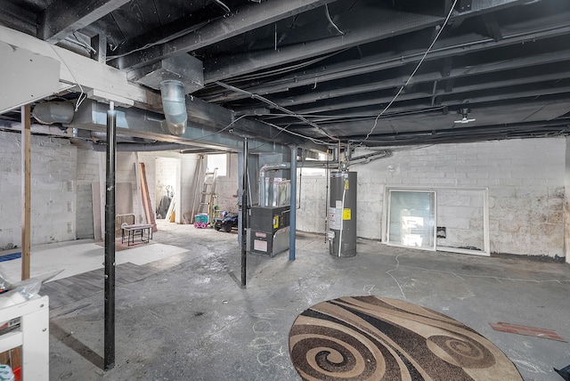 basement featuring heating unit and gas water heater