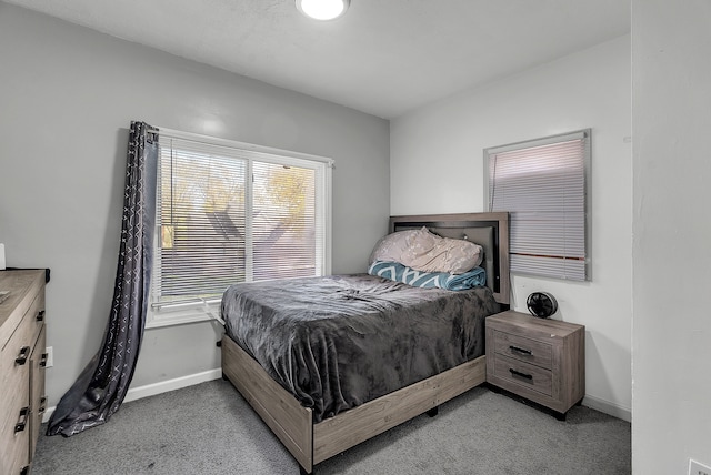 bedroom featuring light carpet