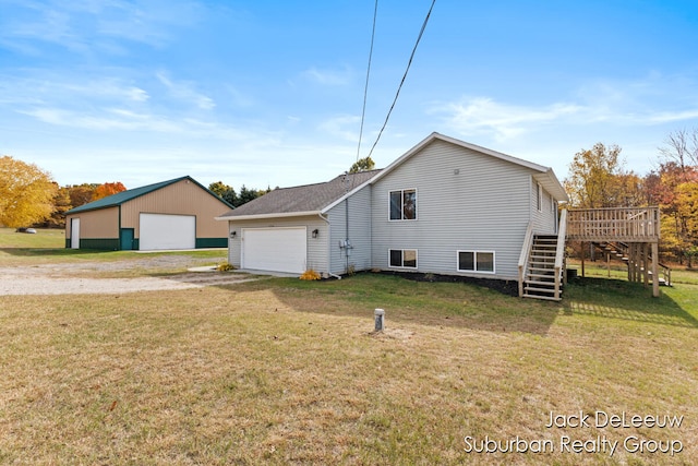 view of side of property featuring a lawn and a wooden deck