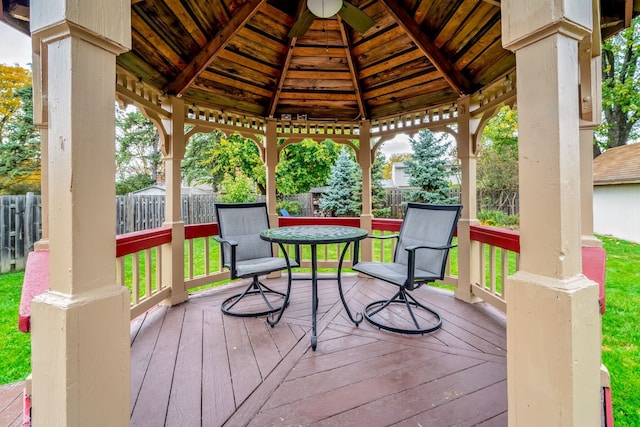 wooden deck featuring a gazebo and ceiling fan