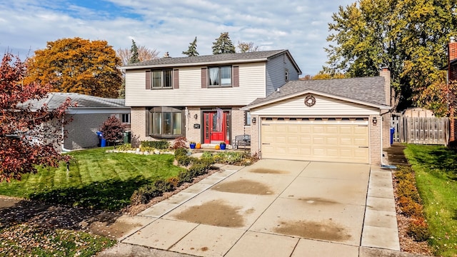 front of property featuring a garage and a front lawn