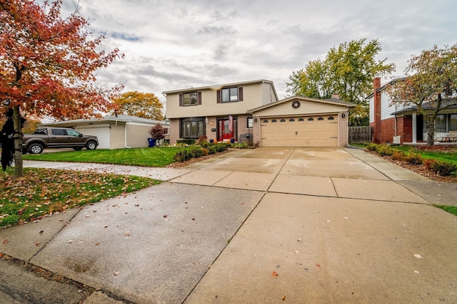 front of property with a garage and a front lawn