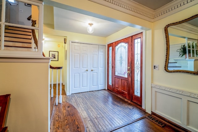 entryway with dark hardwood / wood-style flooring