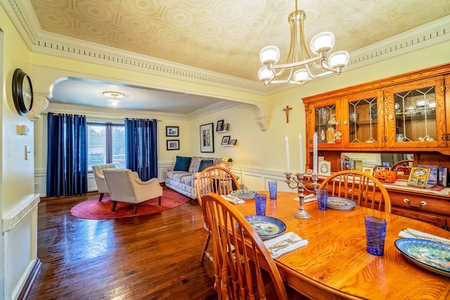 dining room featuring dark hardwood / wood-style flooring and crown molding