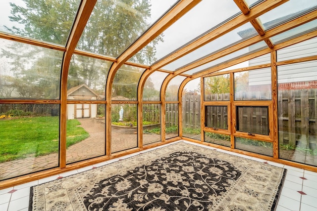 unfurnished sunroom featuring plenty of natural light