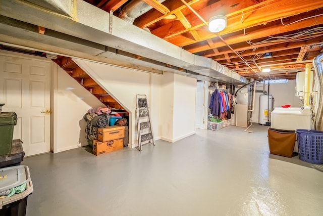 basement featuring heating unit, washer / dryer, and water heater