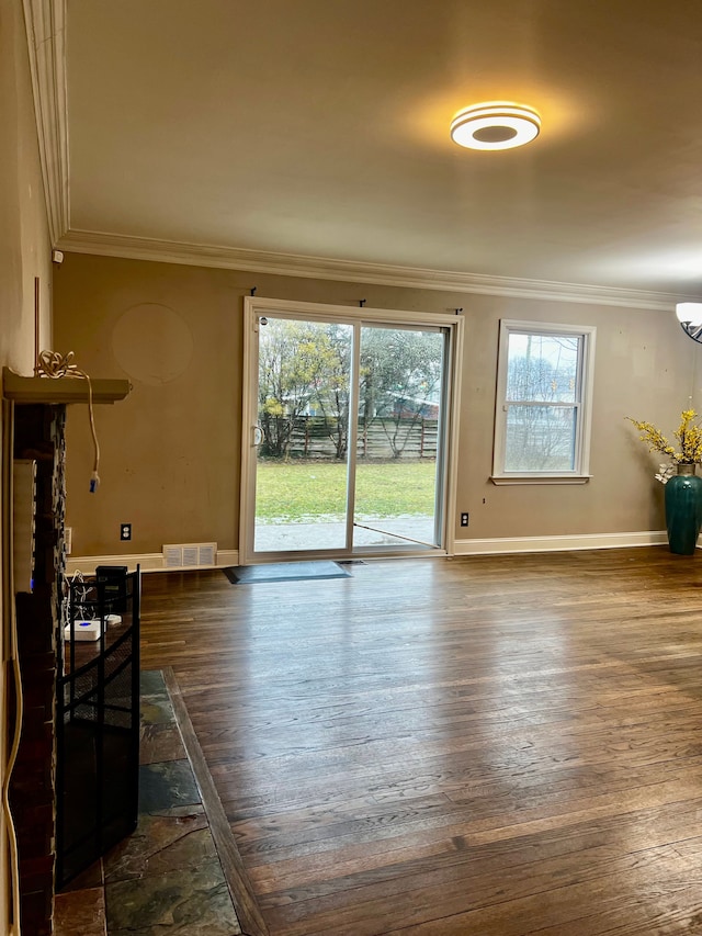 living room with ornamental molding and dark hardwood / wood-style floors