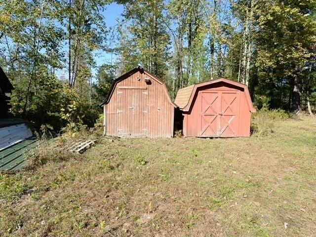 view of outdoor structure with a lawn