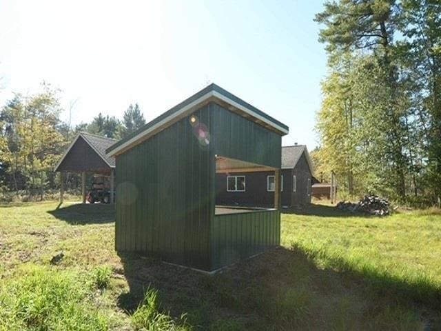 view of property exterior with a yard