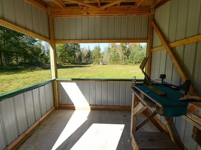 unfurnished sunroom featuring a healthy amount of sunlight