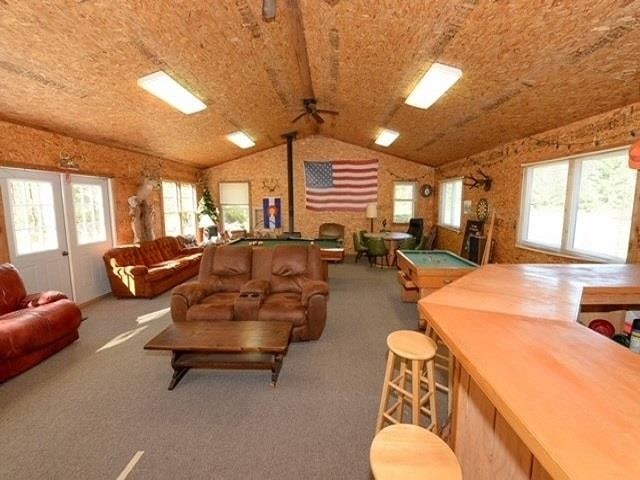 living room with lofted ceiling, carpet floors, a healthy amount of sunlight, and billiards