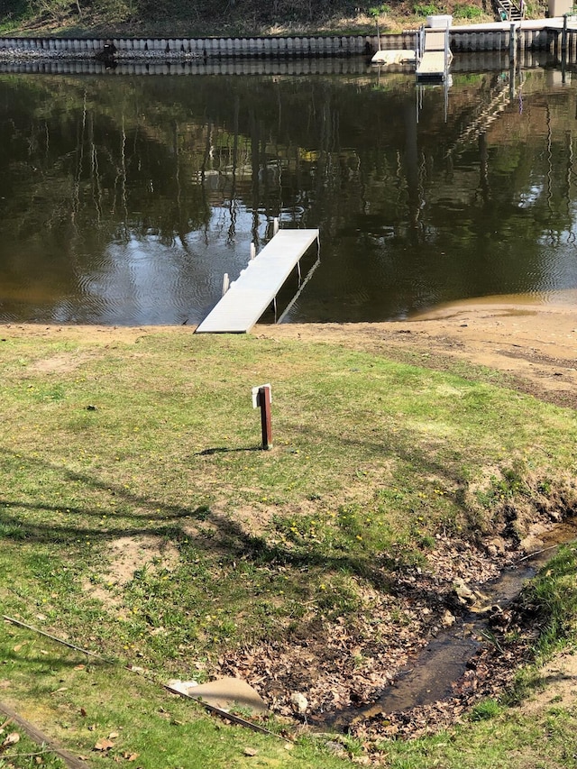 dock area featuring a water view