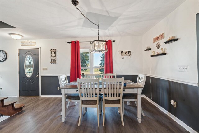 16248 Wabash Rd, Waldron, MI 49288 - dining area featuring a chandelier, wood finished floors, and wainscoting