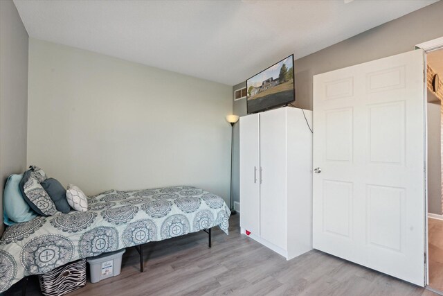 bedroom featuring light wood-type flooring