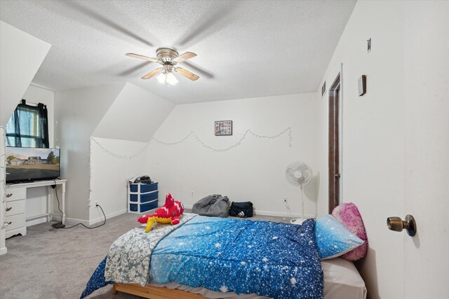 carpeted bedroom with ceiling fan and a textured ceiling