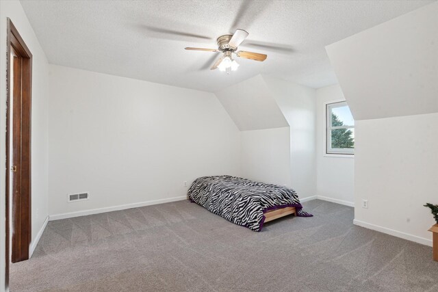 16248 Wabash Rd, Waldron, MI 49288 - carpeted bedroom with lofted ceiling, baseboards, a textured ceiling, and ceiling fan
