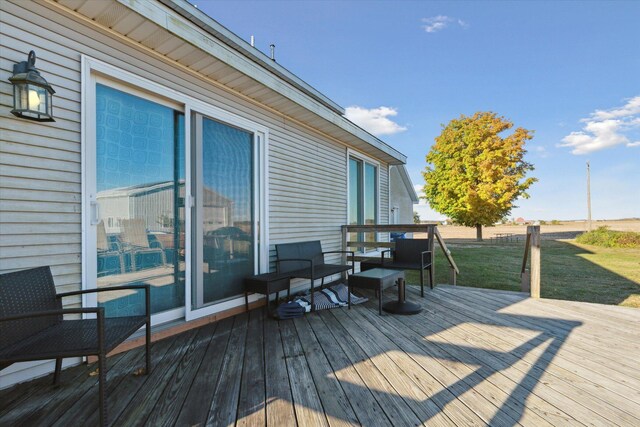 wooden deck with a lawn