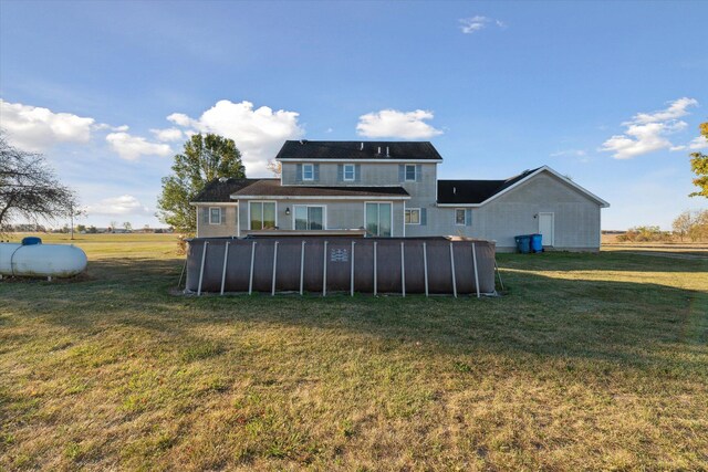 16248 Wabash Rd, Waldron, MI 49288 - rear view of property with a pool and a yard