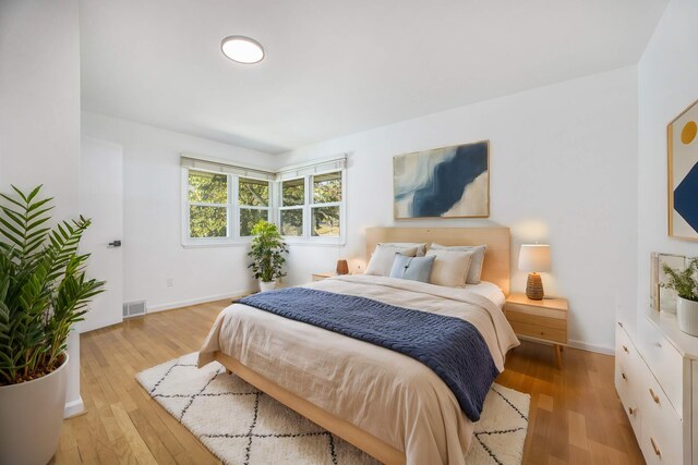 bedroom with light hardwood / wood-style floors