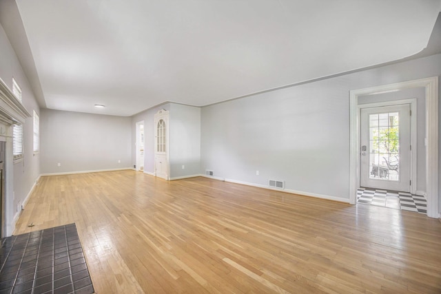 unfurnished living room featuring light wood-type flooring