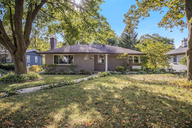 single story home with a front lawn