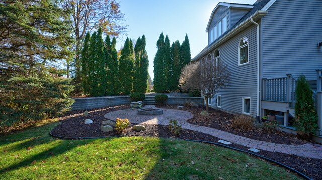 5280 O Connor Pass, Swartz Creek, MI 48473 - view of grassy yard featuring an outdoor fire pit