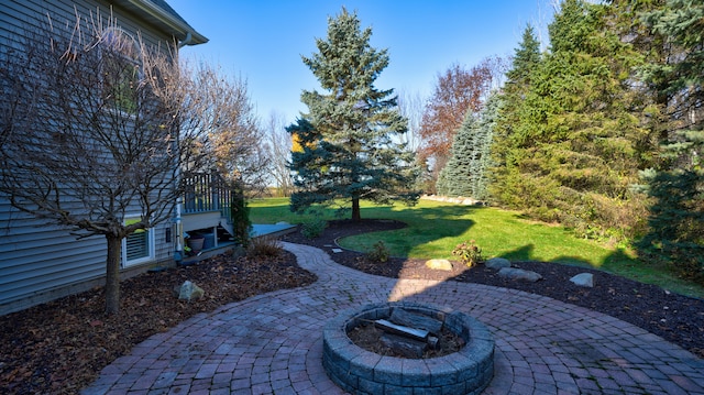 view of patio with a fire pit