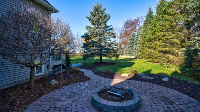 5280 O Connor Pass, Swartz Creek, MI 48473 - view of grassy yard featuring a patio and a fire pit