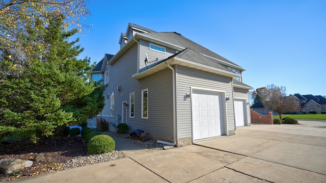 view of side of home with a garage