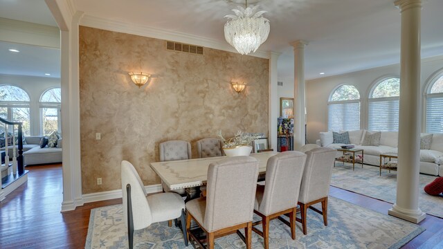 5280 O Connor Pass, Swartz Creek, MI 48473 - dining area with ornate columns, wood finished floors, ornamental molding, baseboards, and a chandelier