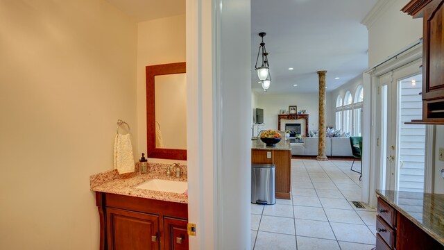 5280 O Connor Pass, Swartz Creek, MI 48473 - bathroom with vanity, tile patterned flooring, a fireplace, and decorative columns