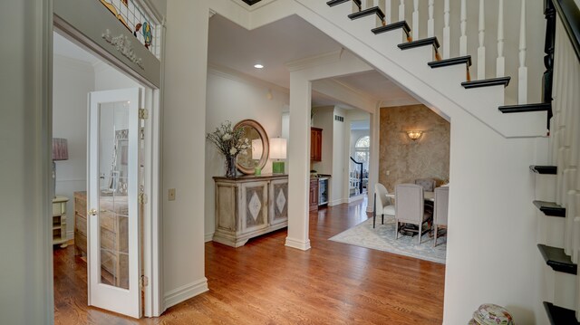 5280 O Connor Pass, Swartz Creek, MI 48473 - foyer with crown molding, light wood-style flooring, baseboards, stairs, and recessed lighting