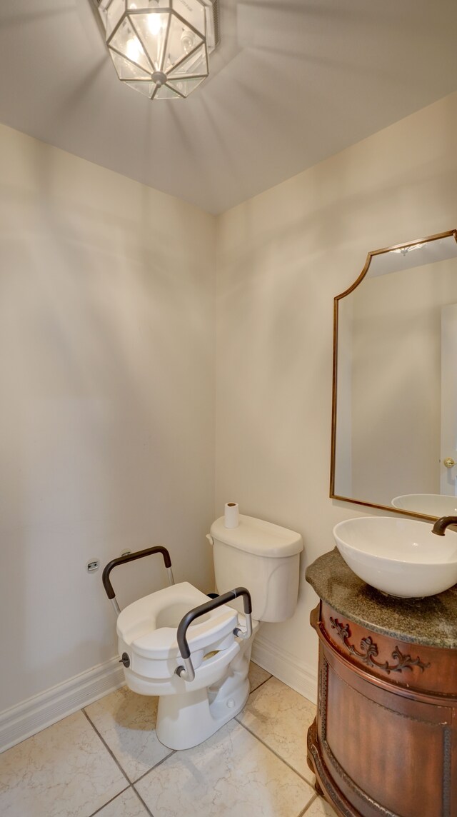 5280 O Connor Pass, Swartz Creek, MI 48473 - bathroom featuring toilet, vanity, and baseboards