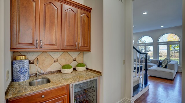 5280 O Connor Pass, Swartz Creek, MI 48473 - indoor bar featuring beverage cooler, tasteful backsplash, wood finished floors, recessed lighting, and stairs