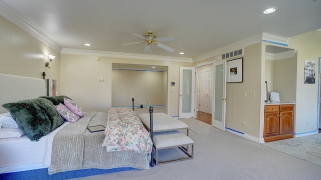 bedroom featuring ceiling fan, crown molding, and light carpet