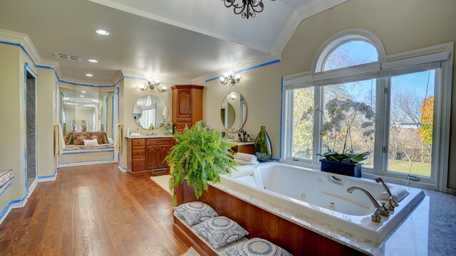 5280 O Connor Pass, Swartz Creek, MI 48473 - bathroom with ornamental molding, vanity, a jetted tub, wood finished floors, and a shower with door
