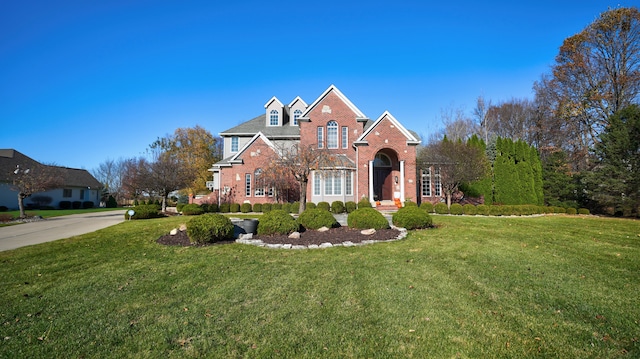 view of property featuring a front lawn