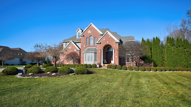 front facade with a front lawn