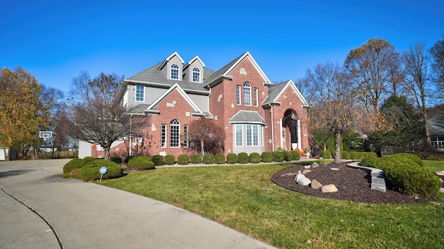 front facade with a front yard