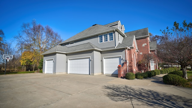 view of side of property with a garage