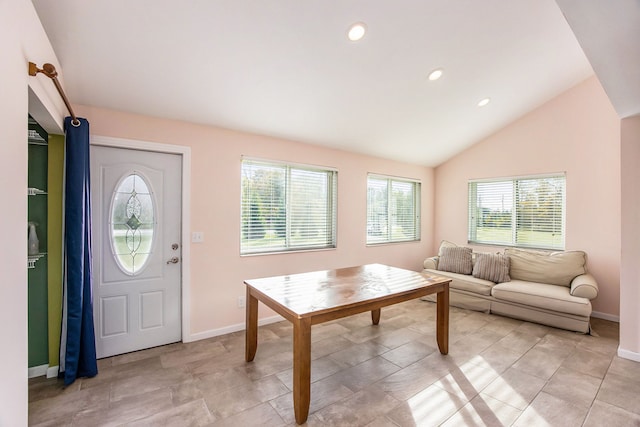 interior space featuring plenty of natural light and lofted ceiling