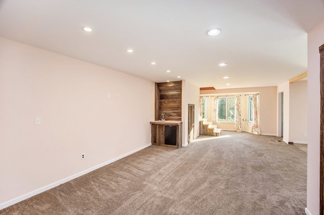 unfurnished living room with light carpet