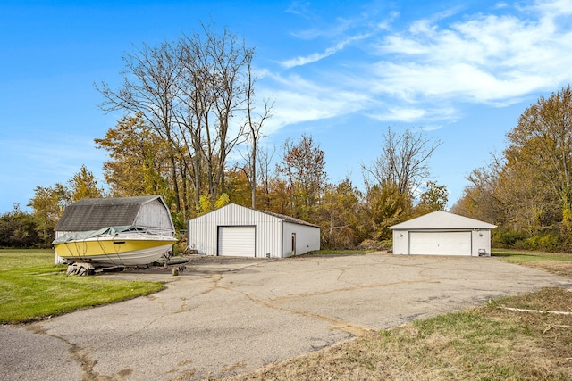 garage featuring a yard